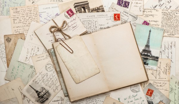 open empty diary book, old letters, french postcards. scrapbook